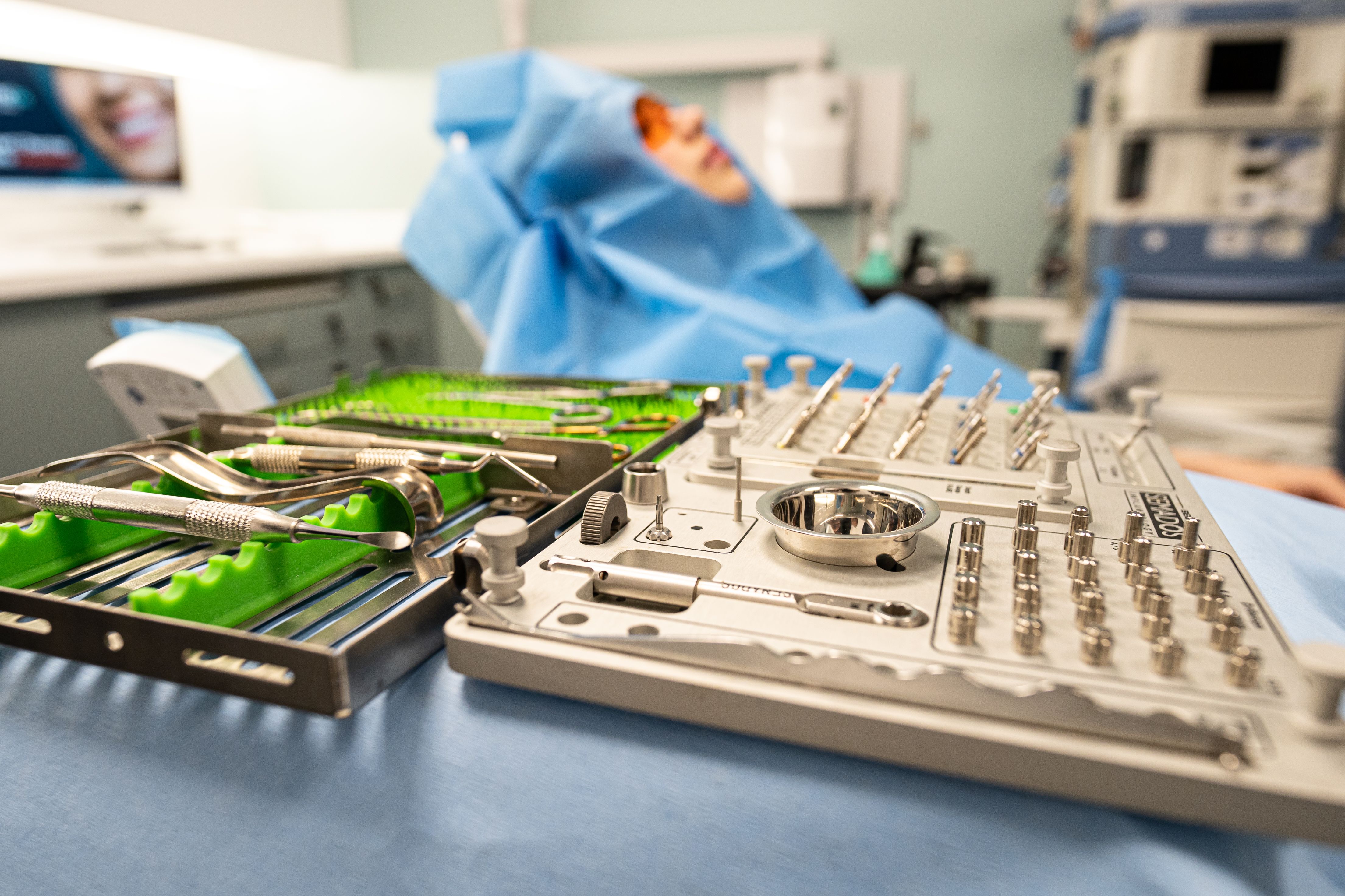 Sterile surgical tray with a patient draped and ready in a Dentix24 operatory